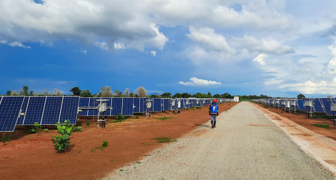 person working on vegetation control on solar site