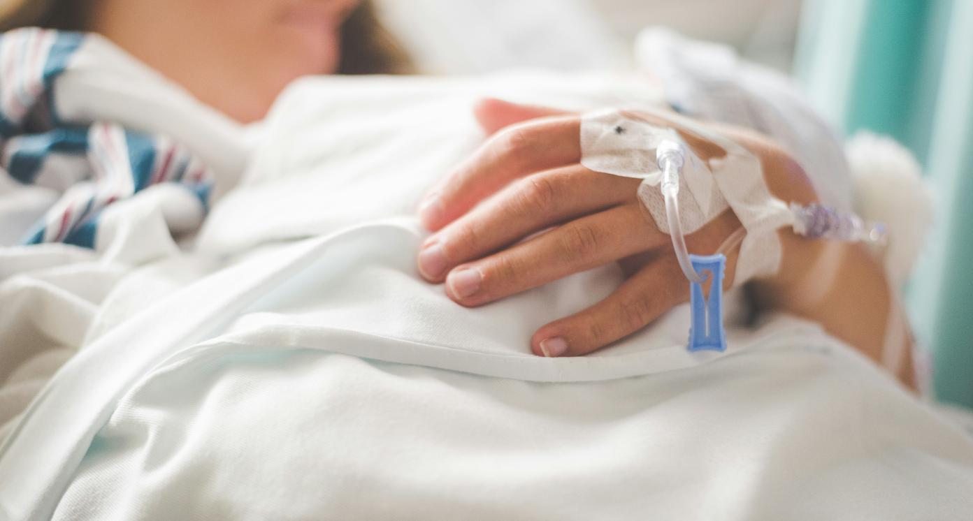 Mother with newborn on a hospital bed